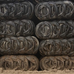 Bales of mud splashed tyres