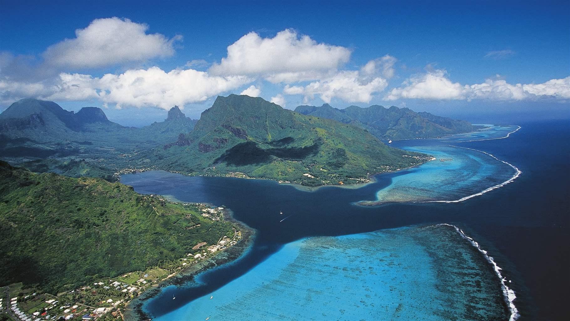 Aerial view of Cook's Bay with its coral reef, Moorea, Society Islands, French Polynesia, Overseas Territory of France.