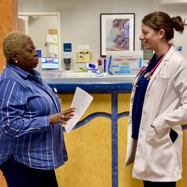 Peer support specialist Dinah Collins briefs emergency physician Lindsey Jennings on an addiction patient at Medical University of South Carolina.