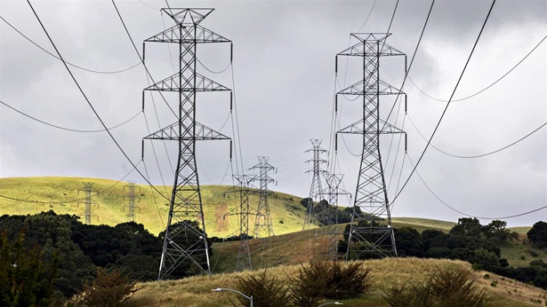 High-voltage power transmission lines owned by PG&amp;E are seen stretched across a neighborhood in western San Ramon, Calif. Friday, May 17, 2019.