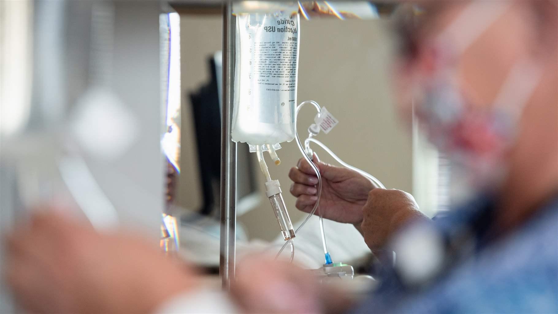 Charlotte Welborn, a registered nurse, administers intravenous antibiotics to a patient in the medical, surgical and pediatric unit at Randolph Health in Asheboro, North Carolina on Tuesday, June 7, 2022.