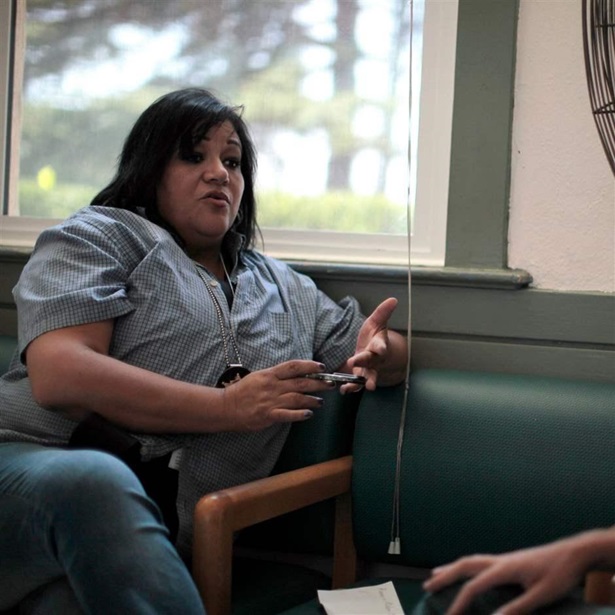 Orange County Deputy Probation Officer Christine Torres talks to a probationer who has broken the terms of his probation in Santa Ana, California 
