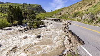  aThe North Entrance Road in Yellowstone National Park is washed out by flooding in the park on June 18, 2022.