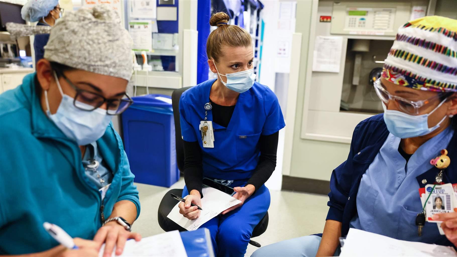 Medical Intensive Care Unit manager discusses upcoming staffing with registered nurses in the Intensive Care Unit (ICU) at Sharp Grossmont Hospital.