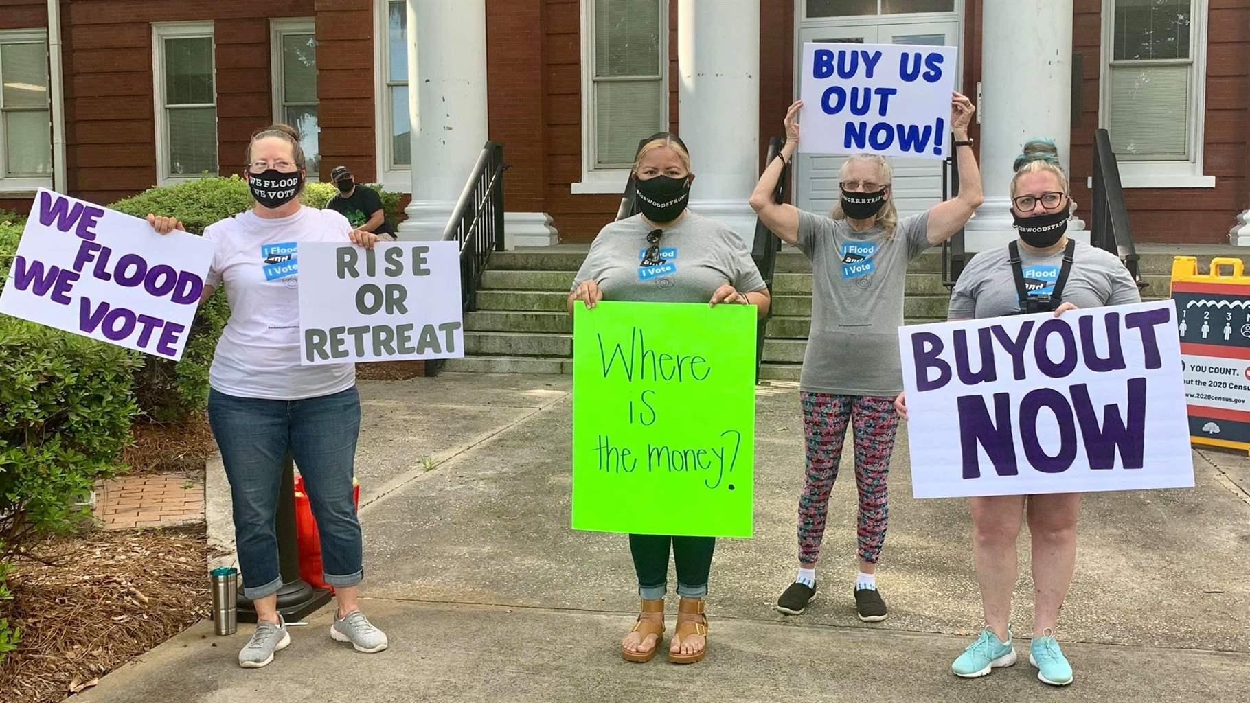 In July 2020, Straka (left) and Rosewood Strong co-founder Melissa Krupa (far right) demonstrated with fellow group members (center, left to right) Vivian Vega and Darlene Demi outside the Horry County Court House in support of a buyout program for flood victims. The protest was widely covered by local media.