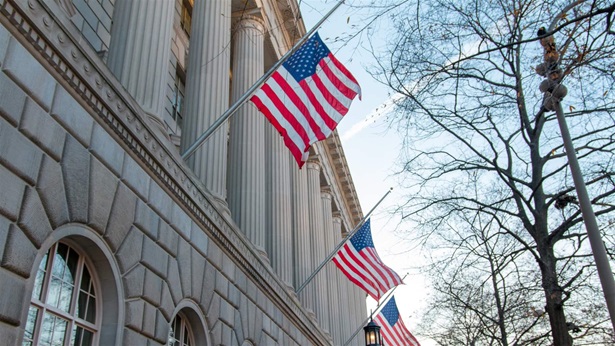 American Flags hanging off historic building