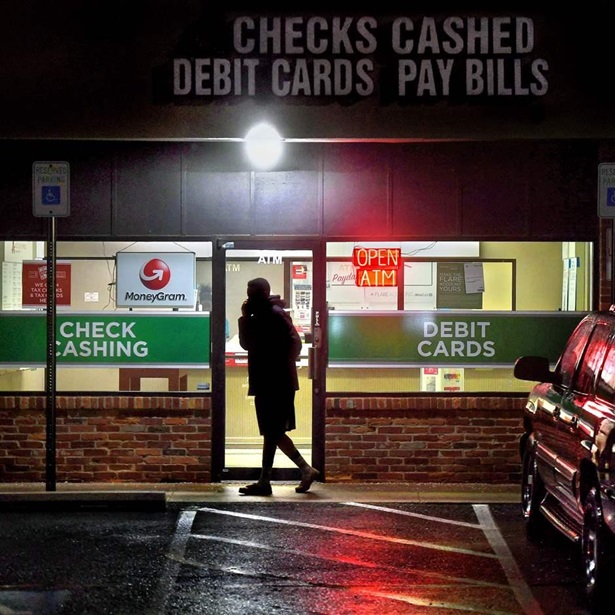 A customer leaves a payday loan store on Frederick Rd. in Gaithersburg, Maryland.