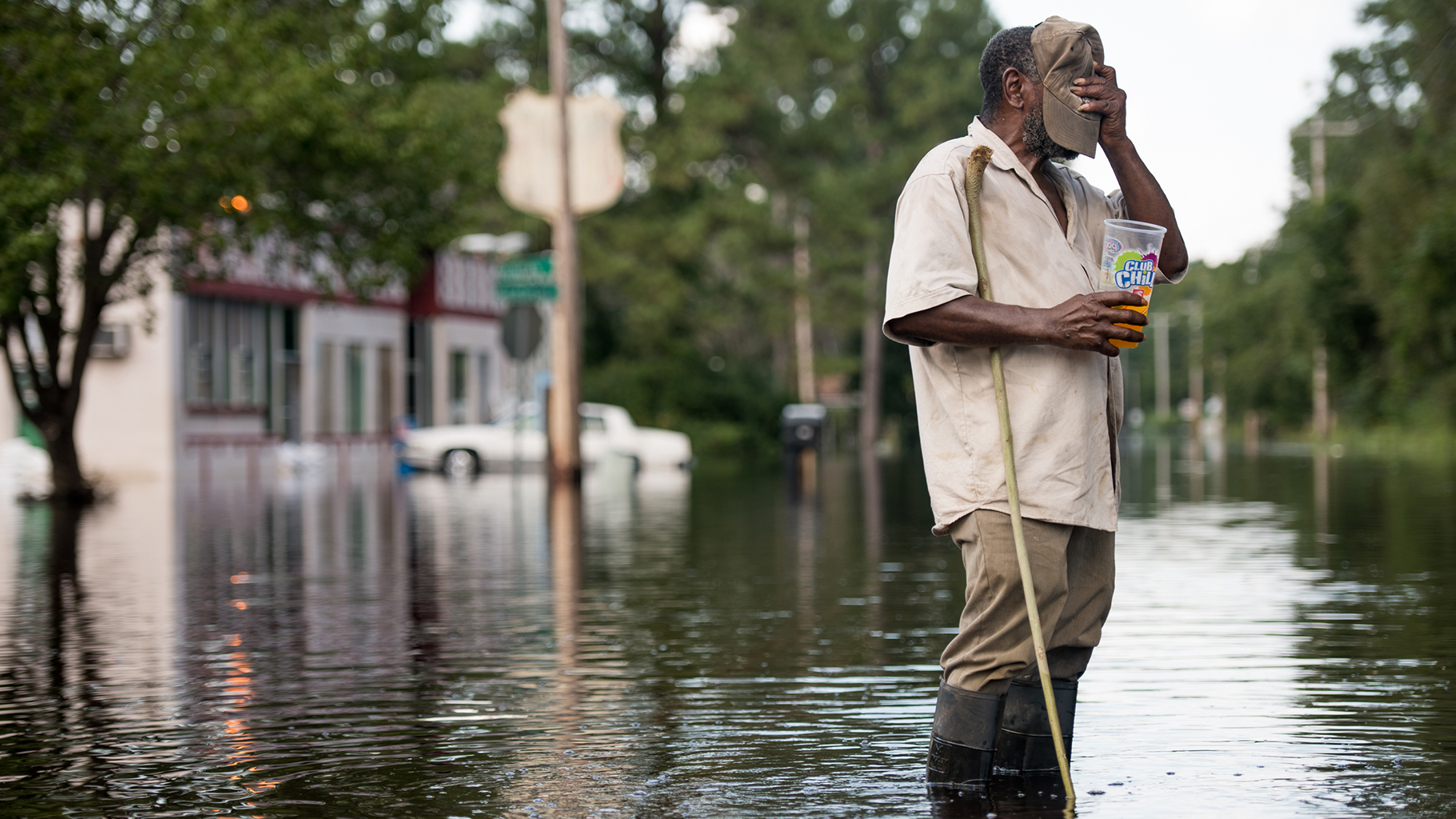 A man stands in Waccamaw River floodwaters in Bucksport, South Carolina, which was slammed by Hurricane Florence in the fall of 2018